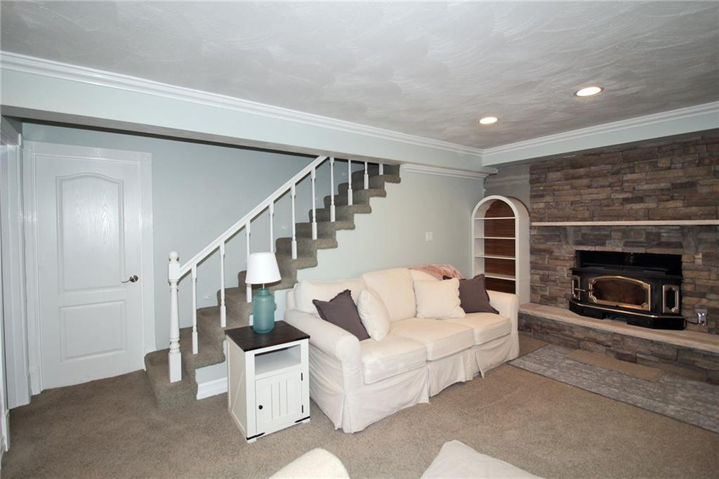Undisclosed Address Cecil, PA 15321 - Photo 17 of 29 a living room with furniture and a fireplace