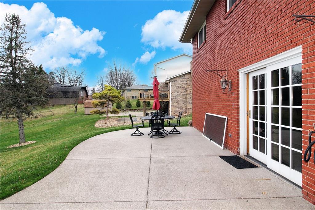 Undisclosed Address Cecil, PA 15321 - Photo 28 of 29 a view of a patio with a table and chairs