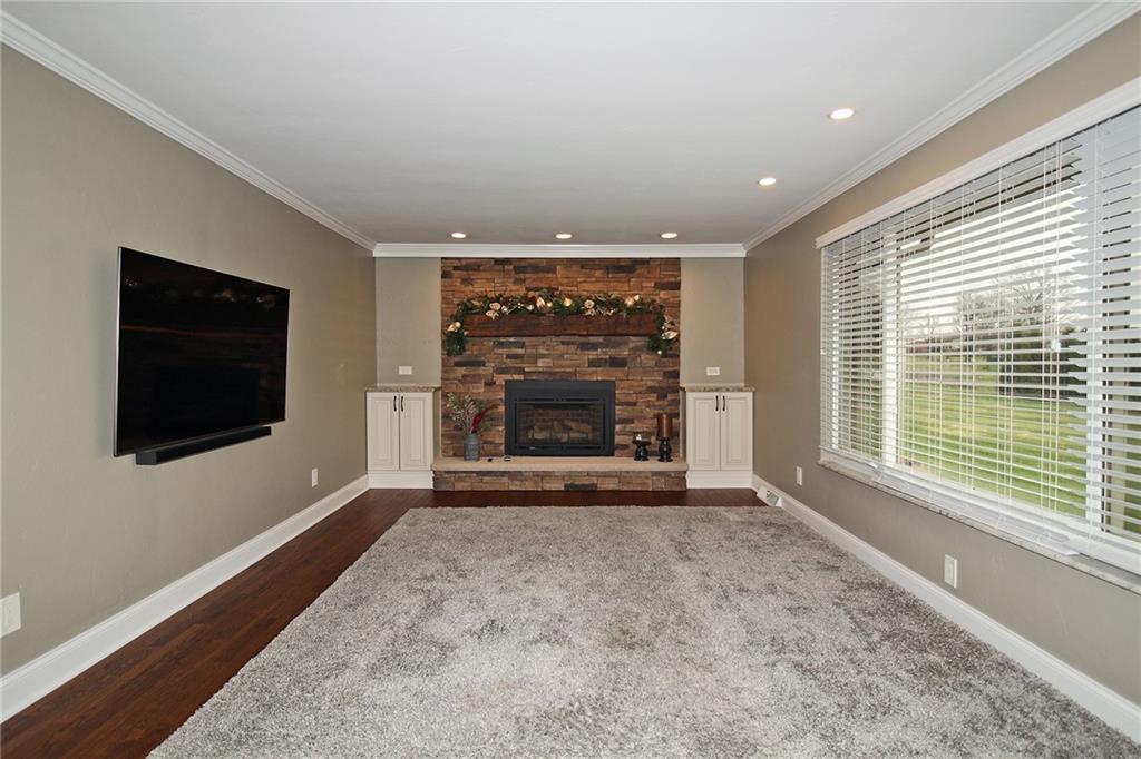 Undisclosed Address Cecil, PA 15321 - Photo 3 of 29 a view of an empty room with a fireplace and a window
