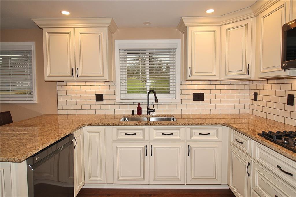 Undisclosed Address Cecil, PA 15321 - Photo 5 of 29 a kitchen with granite countertop a sink and a window