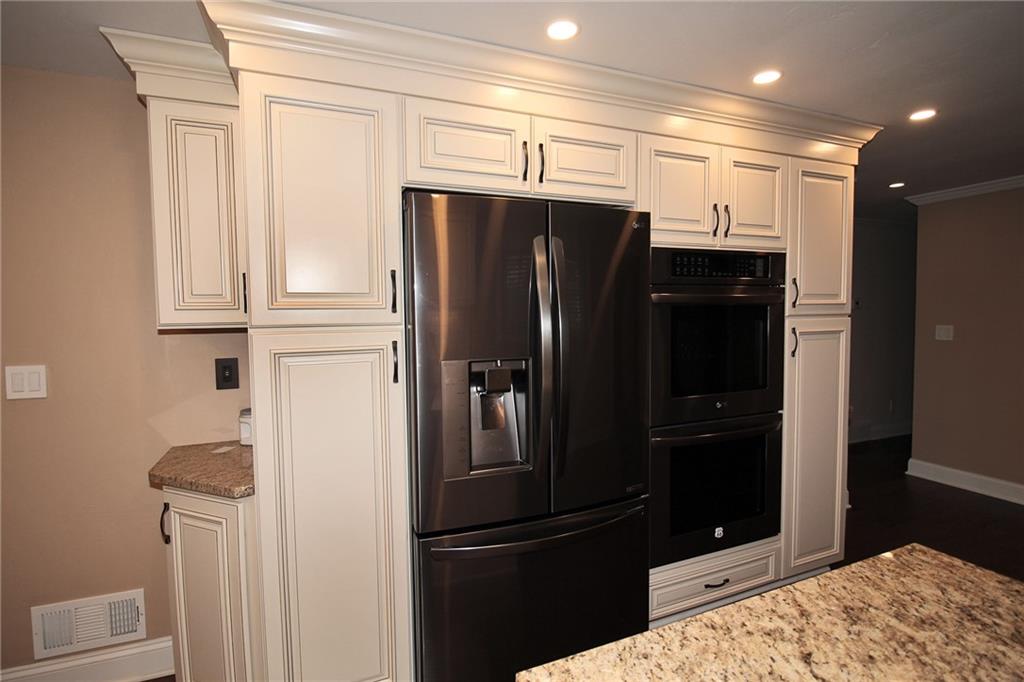 Undisclosed Address Cecil, PA 15321 - Photo 7 of 29 a kitchen with stainless steel appliances granite countertop a refrigerator and a sink