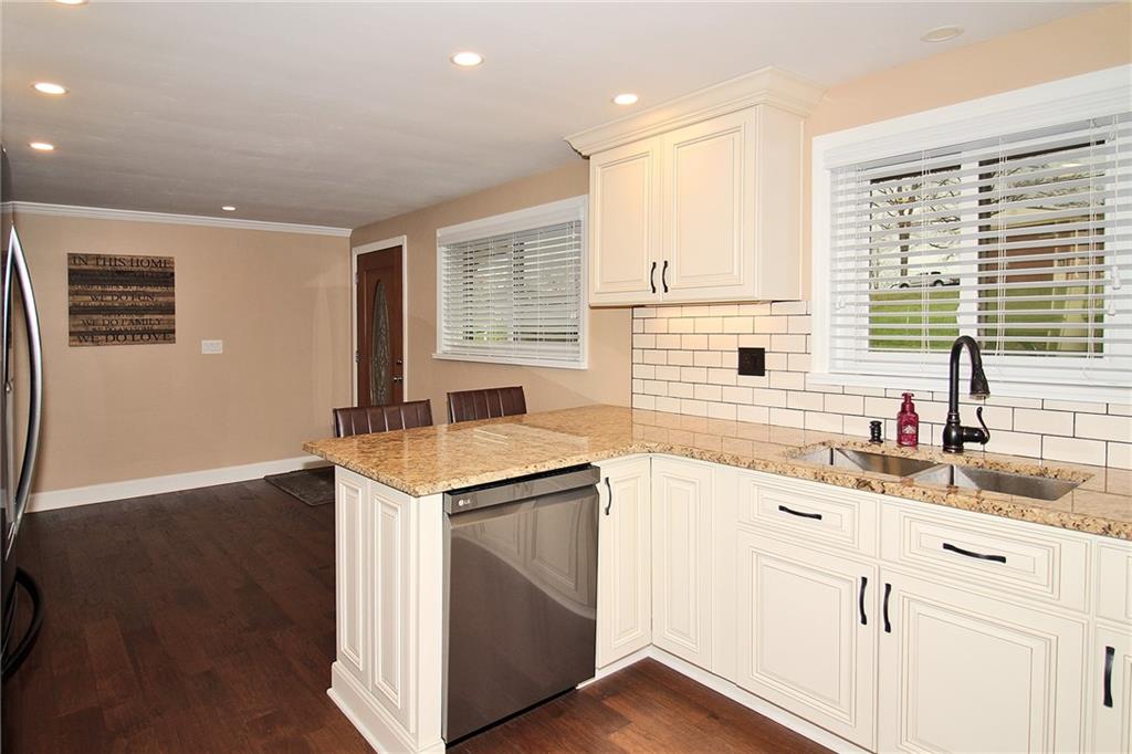 Undisclosed Address Cecil, PA 15321 - Photo 8 of 29 a kitchen with a sink stove and cabinets