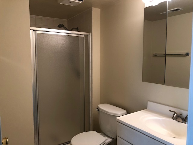 624 Quail Run Road Matteson, IL 60443 - Photo 14 of 30 a white toilet sitting next to a bathroom sink