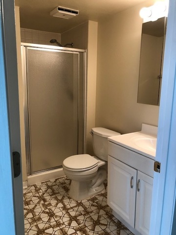 624 Quail Run Road Matteson, IL 60443 - Photo 15 of 30 a bathroom with a granite countertop toilet and a shower