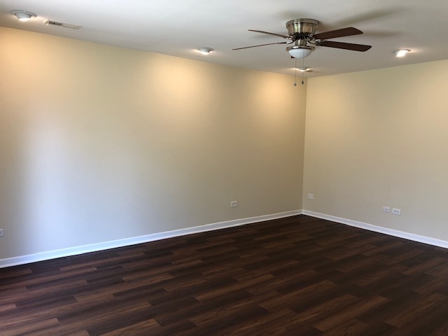 624 Quail Run Road Matteson, IL 60443 - Photo 19 of 30 a view of an empty room with wooden floor