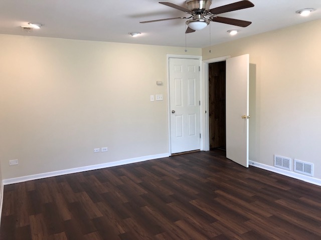 624 Quail Run Road Matteson, IL 60443 - Photo 21 of 30 an empty room with wooden floor and windows