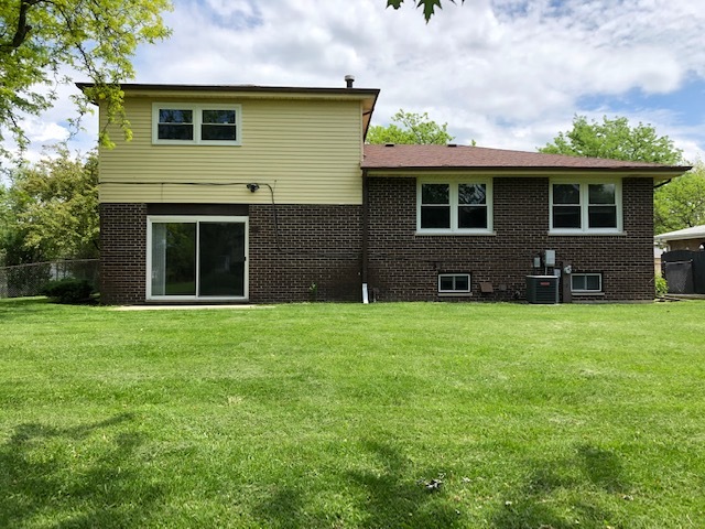 624 Quail Run Road Matteson, IL 60443 - Photo 29 of 30 a view of a yard in front of a house with large windows