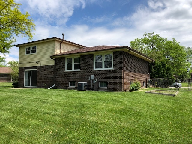 624 Quail Run Road Matteson, IL 60443 - Photo 30 of 30 a front view of house with yard and trees in the background