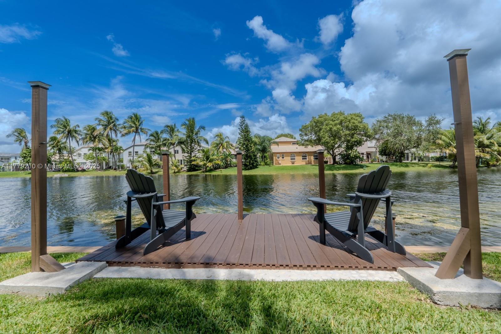Towngate Pembroke Pines, FL 33028 - Photo 36 of 41 a view of a lake with a bench and a bench