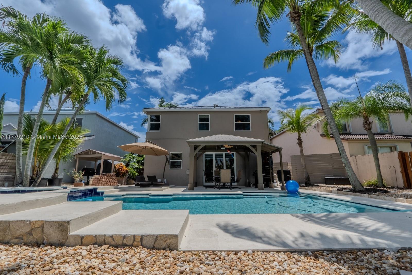Towngate Pembroke Pines, FL 33028 - Photo 37 of 41 a front view of a house with garden