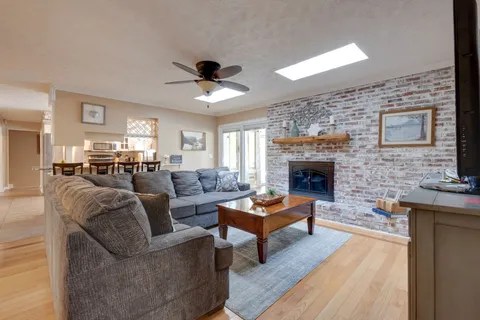 a kitchen with stainless steel appliances a stove a sink and a refrigerator
