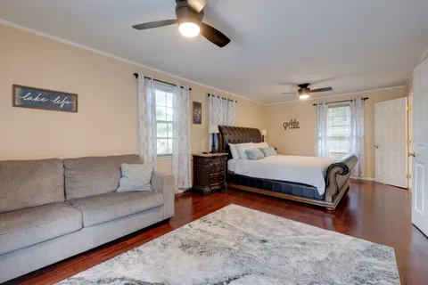 a bedroom with a bed and a dresser