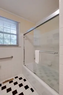 a kitchen with granite countertop a sink stove and cabinets