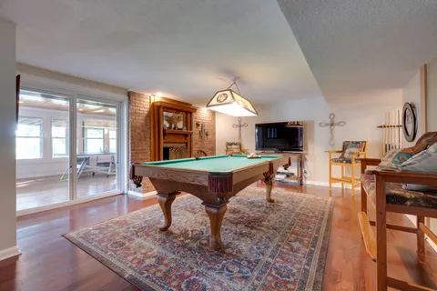 a view of a house with a yard balcony and furniture