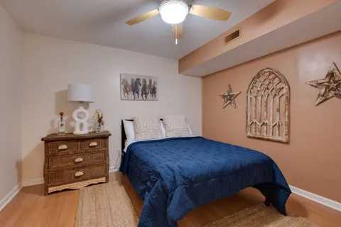 an aerial view of lake residential house with outdoor space and trees around