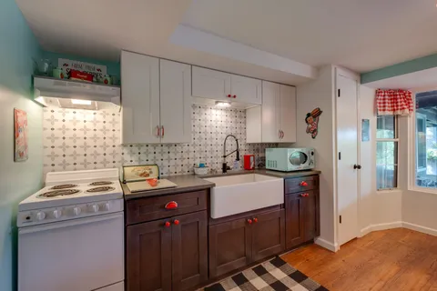 a bedroom with a bed and wall painting