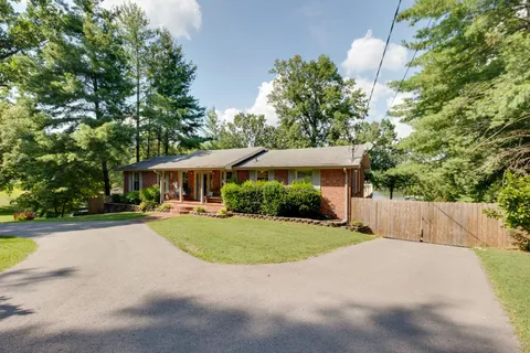 a lobby with furniture and a rug