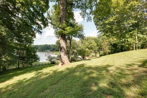 a view of a lake with a big yard