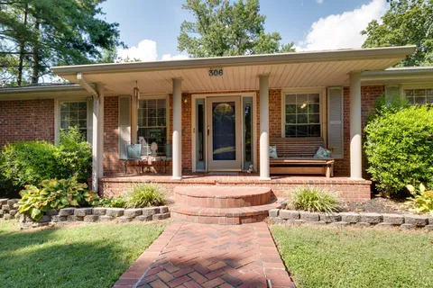 a view of a livingroom with wooden floor and a window