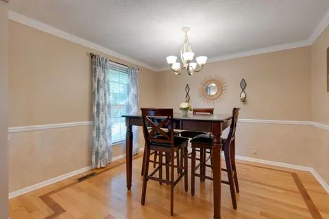 a kitchen with granite countertop a sink stainless steel appliances and cabinets