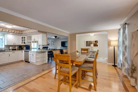 a kitchen with a sink cabinets and window