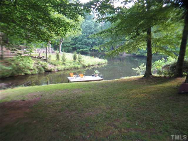 14405 Possum Track Road Raleigh, NC 27614 - Photo 18 of 25 view of the lower back yard leading to the lake
