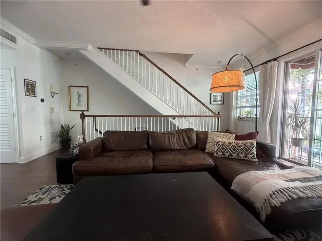 a living room with furniture and a window