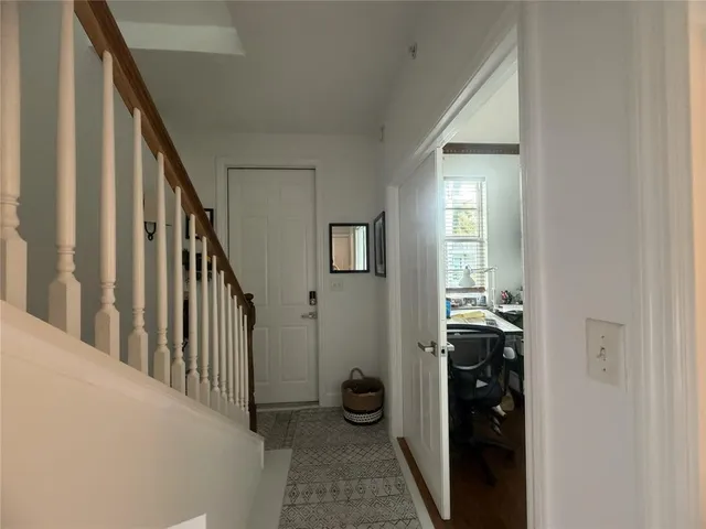 a view of a hallway to a livingroom and a hallway