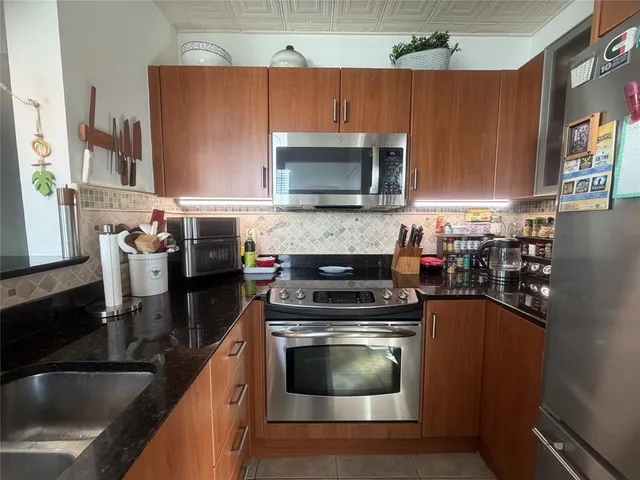 a kitchen with a stove and a microwave
