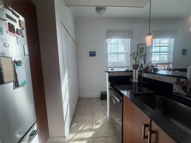 a kitchen with stainless steel appliances a sink stove and cabinets