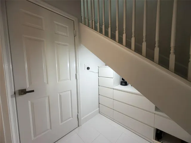 a view of a hallway with washer and dryer