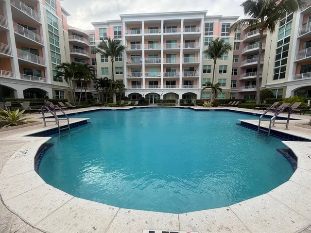 a view of a swimming pool with sitting area