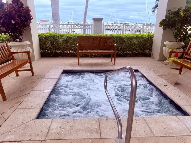 a view of a swimming pool with a lounge chairs