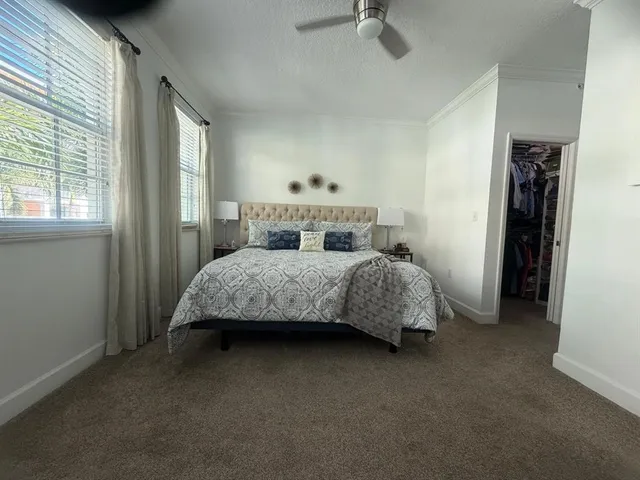 a bedroom with a bed and a cabinets