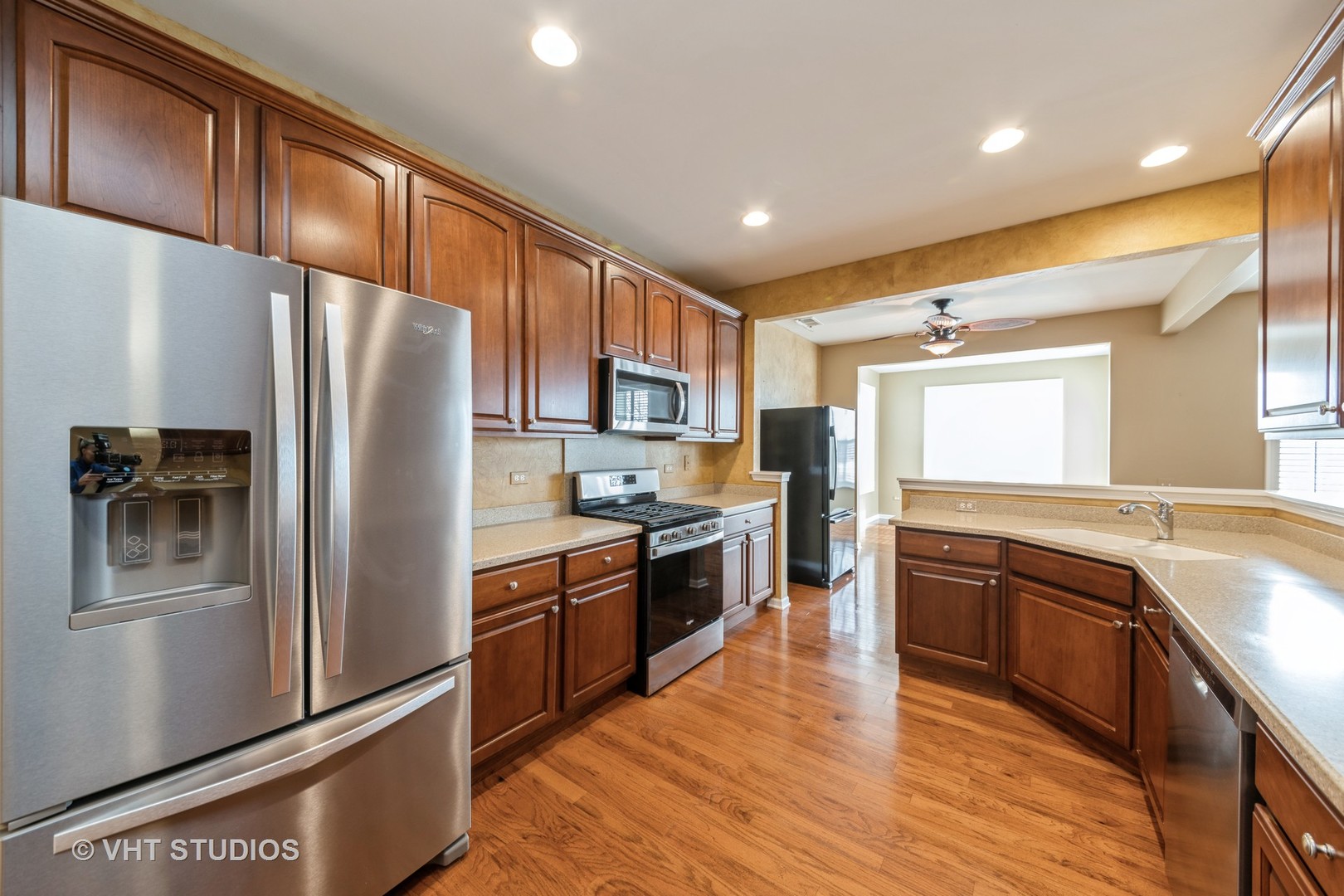 2795 Beacon Point Circle Elgin, IL 60124 - Photo 14 of 28 a kitchen with stainless steel appliances granite countertop a refrigerator a stove top oven a sink and dishwasher