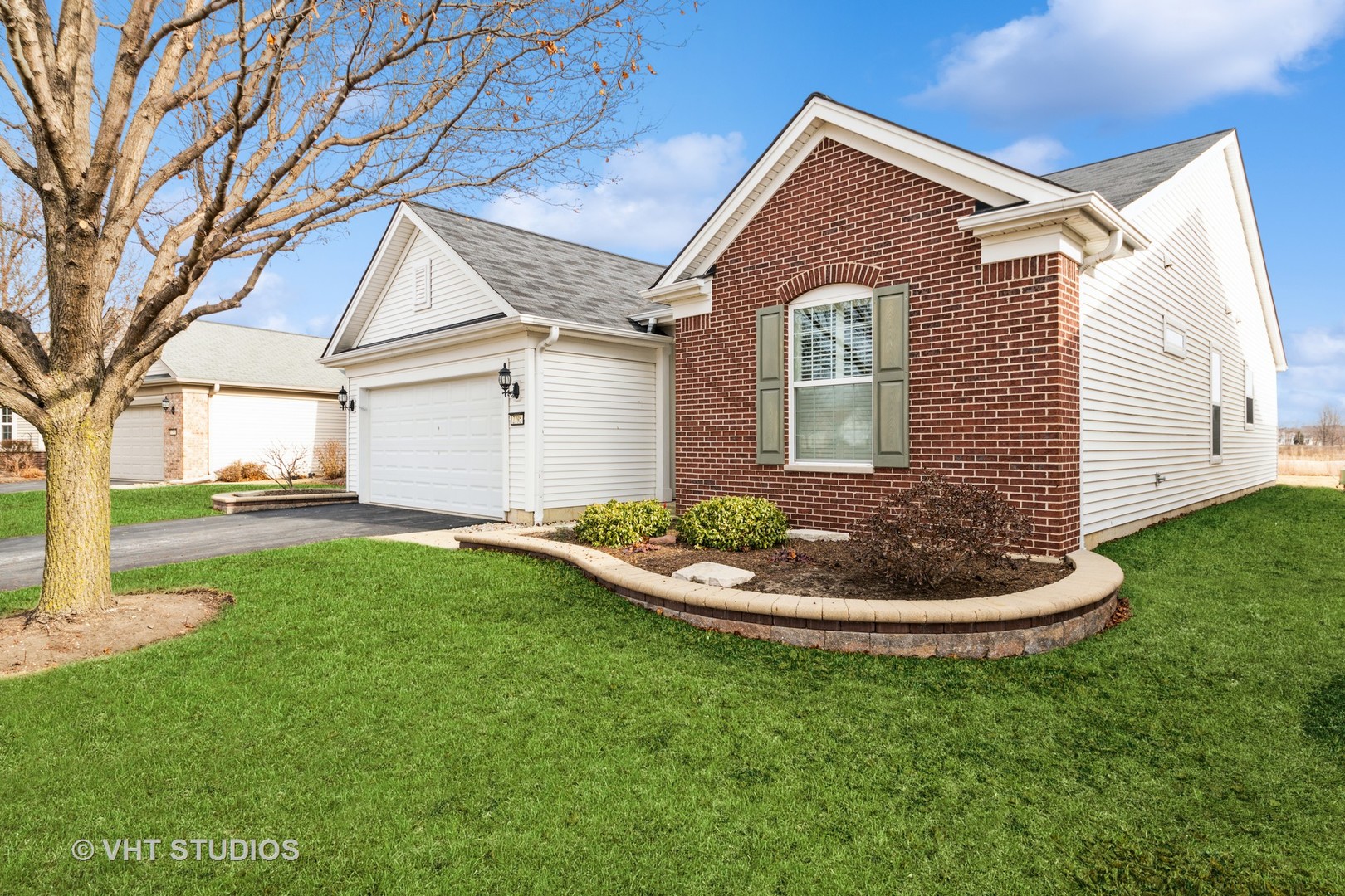 2795 Beacon Point Circle Elgin, IL 60124 - Photo 2 of 28 a front view of a house with a yard