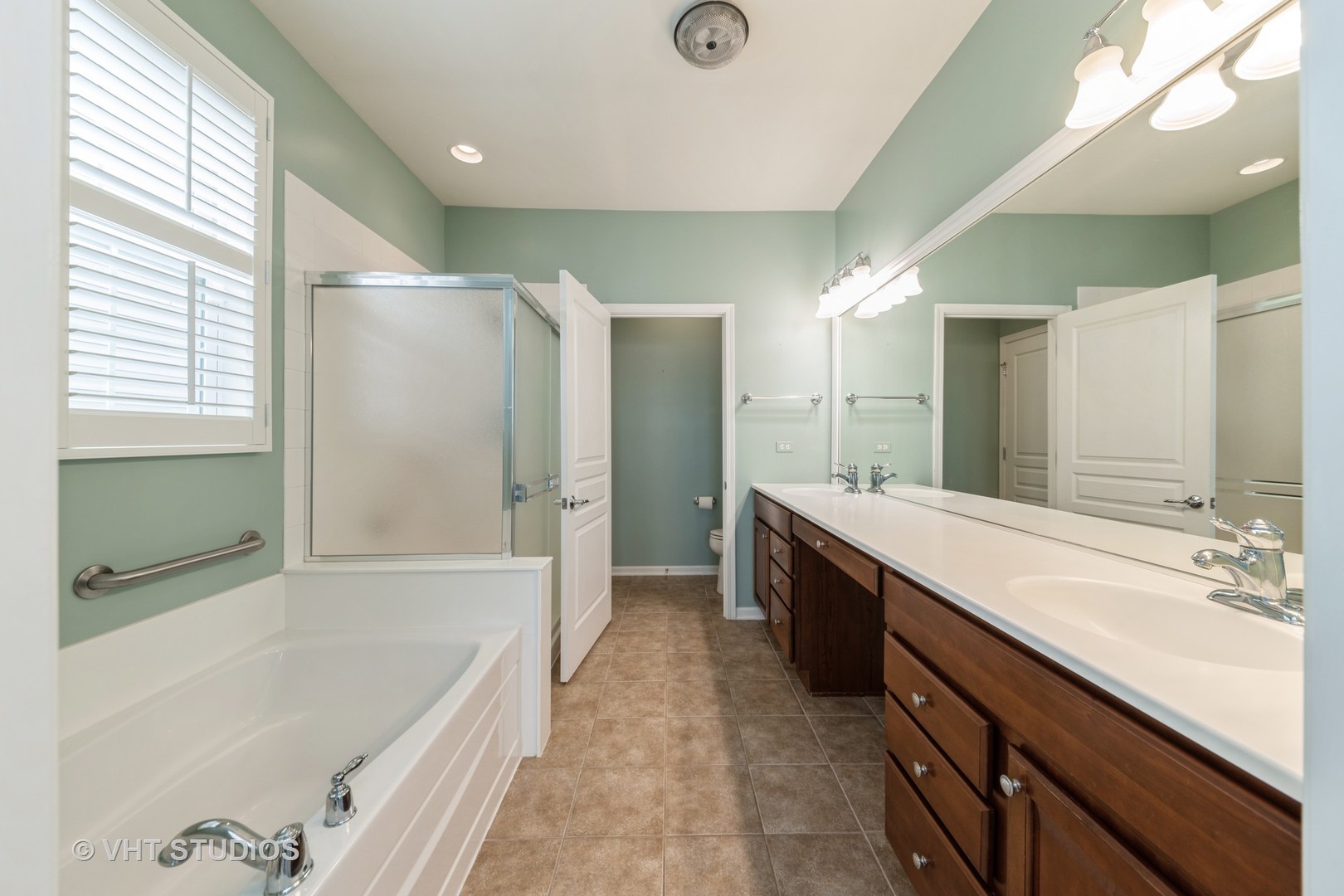 2795 Beacon Point Circle Elgin, IL 60124 - Photo 21 of 28 a spacious bathroom with a tub sink shower and mirror