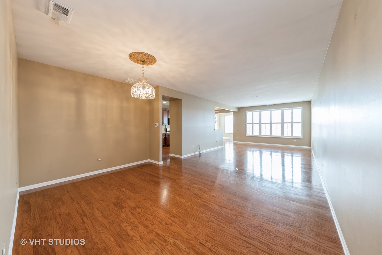 2795 Beacon Point Circle Elgin, IL 60124 - Photo 7 of 28 an empty room with wooden floor and windows