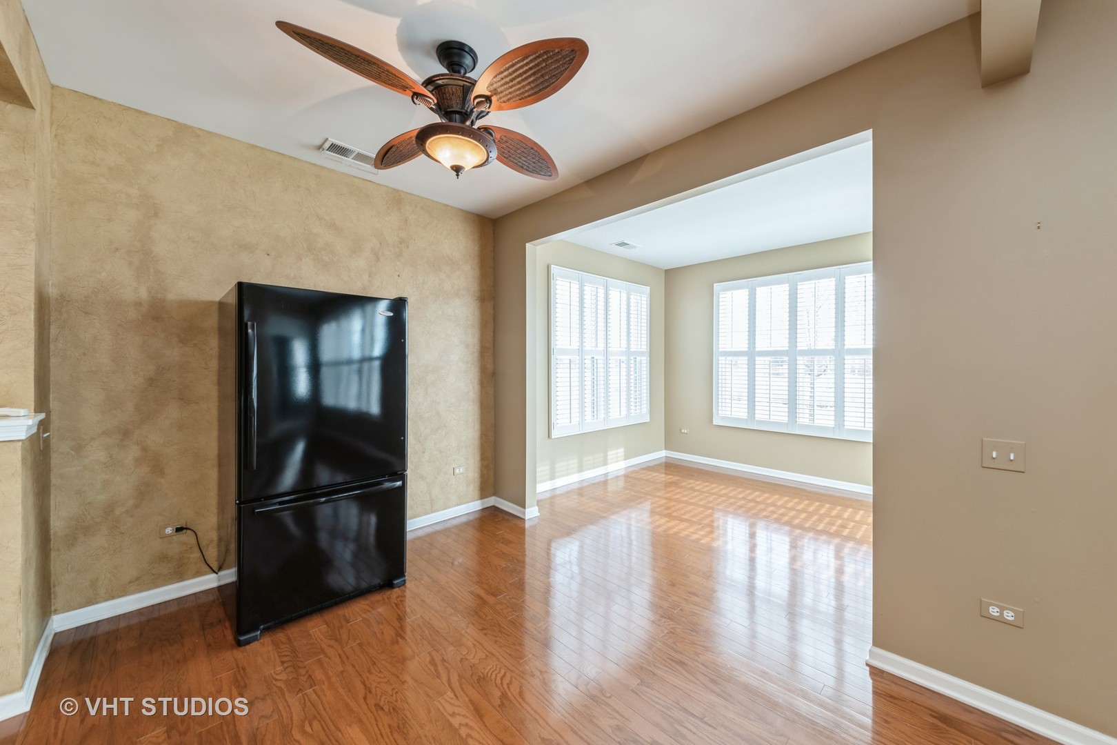 2795 Beacon Point Circle Elgin, IL 60124 - Photo 9 of 28 a view of empty room with wooden floor and fan