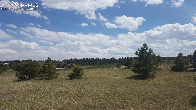 a view of a lake with houses in the back