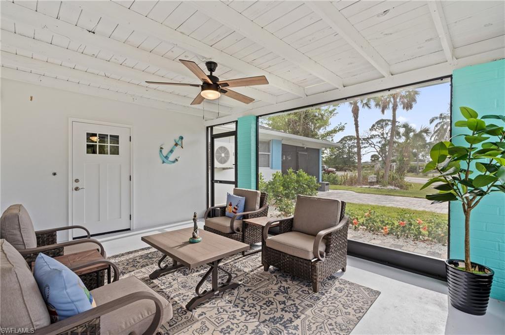 2134 Palm Street Naples, FL 34112 - Photo 4 of 36 Door in enclosed porch leads to private laundry room with full size washer/dryer.