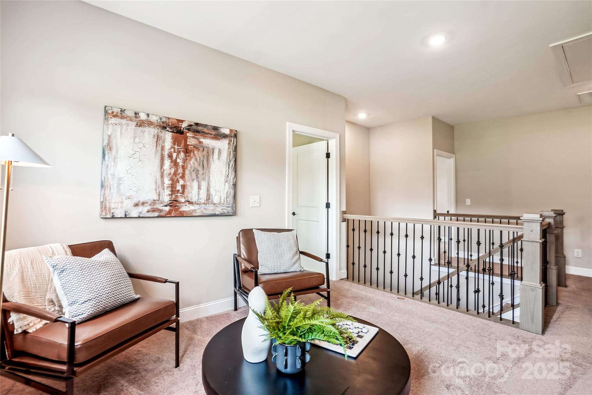 522 Fern Hill Road, Unit 17 Mooresville, NC 28117 - Photo 16 of 16 a living room with furniture and a rug