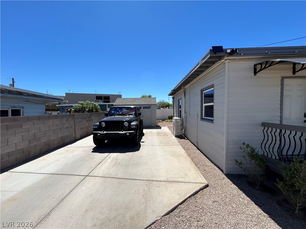 116 West Basic Road Henderson, NV 89015 - Photo 11 of 39 A long concrete driveway could be home to RV or boat parking.