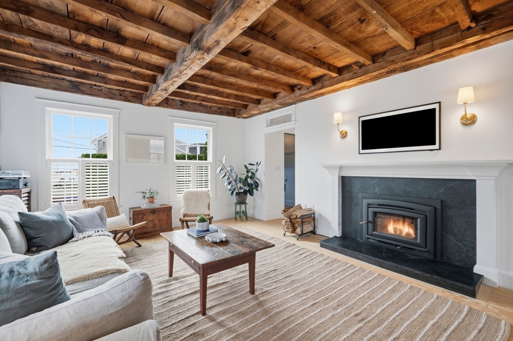 33 Franklin Street Marblehead, MA 01945 - Photo 8 of 42 a living room with furniture a fireplace and a table