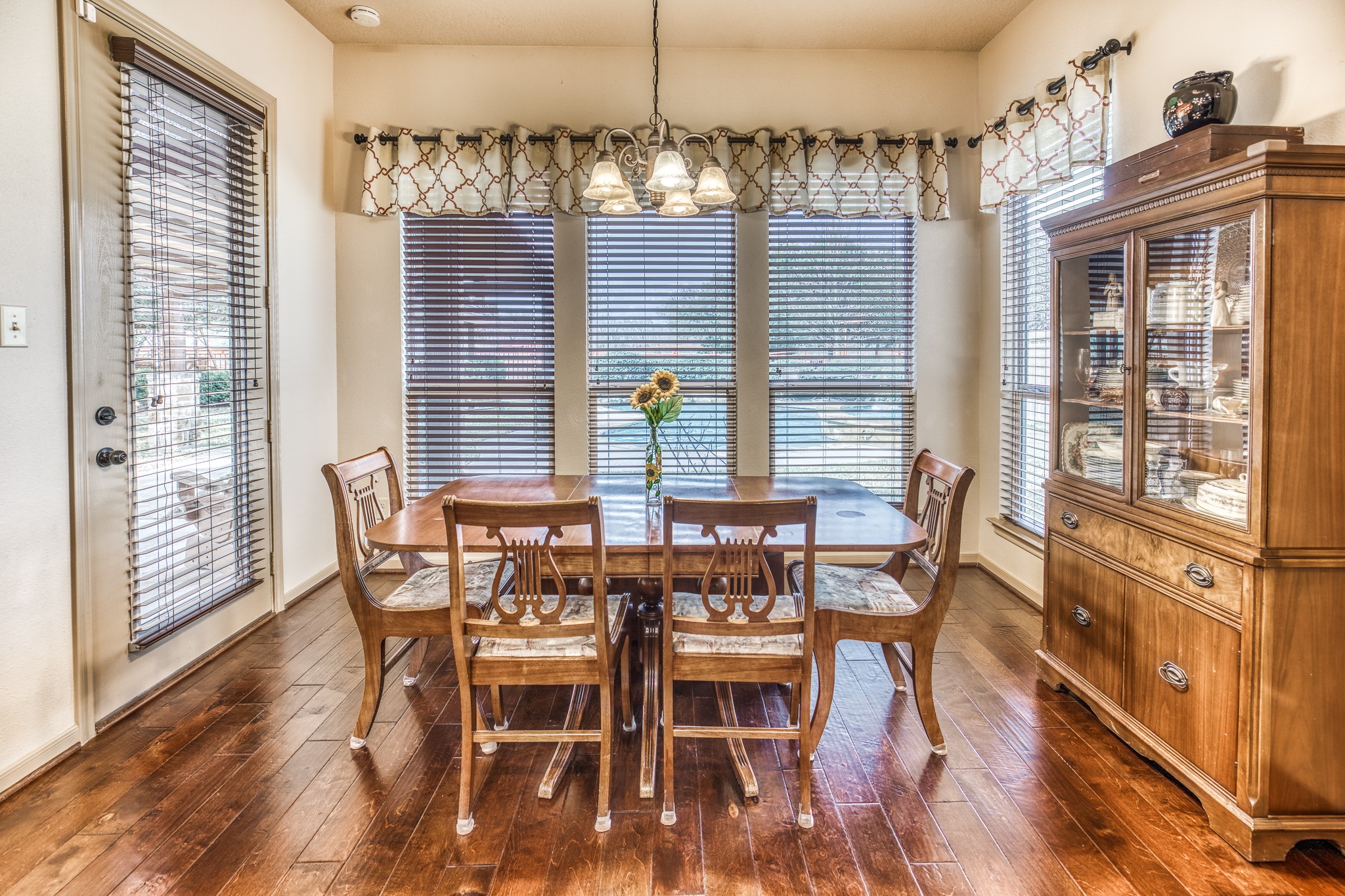 677 Grubbs Road Sealy, TX 77474 - Photo 11 of 40 a view of a dining room with furniture wooden floor and chandelier