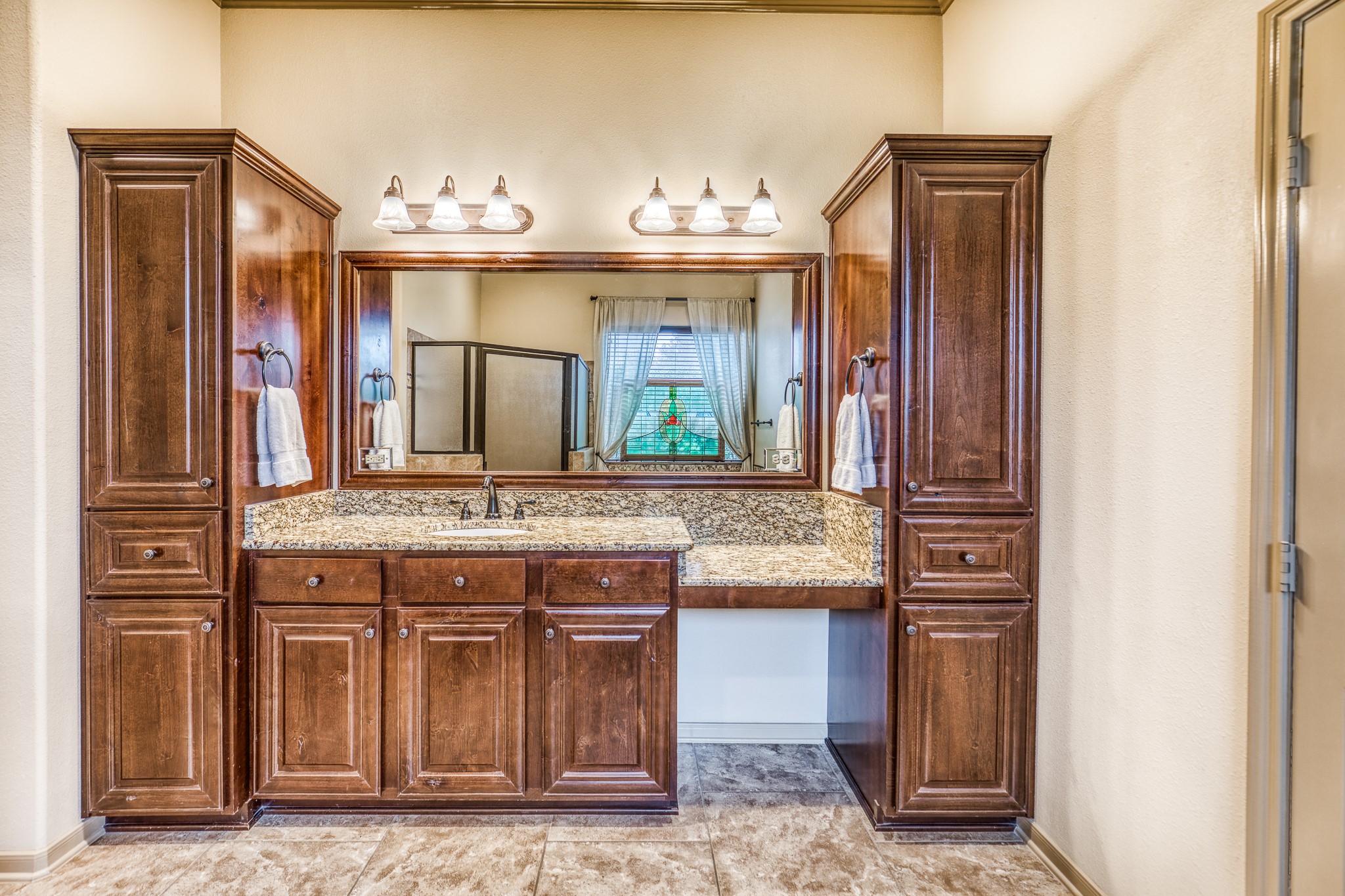 677 Grubbs Road Sealy, TX 77474 - Photo 13 of 40 a bathroom with a sink and a mirror