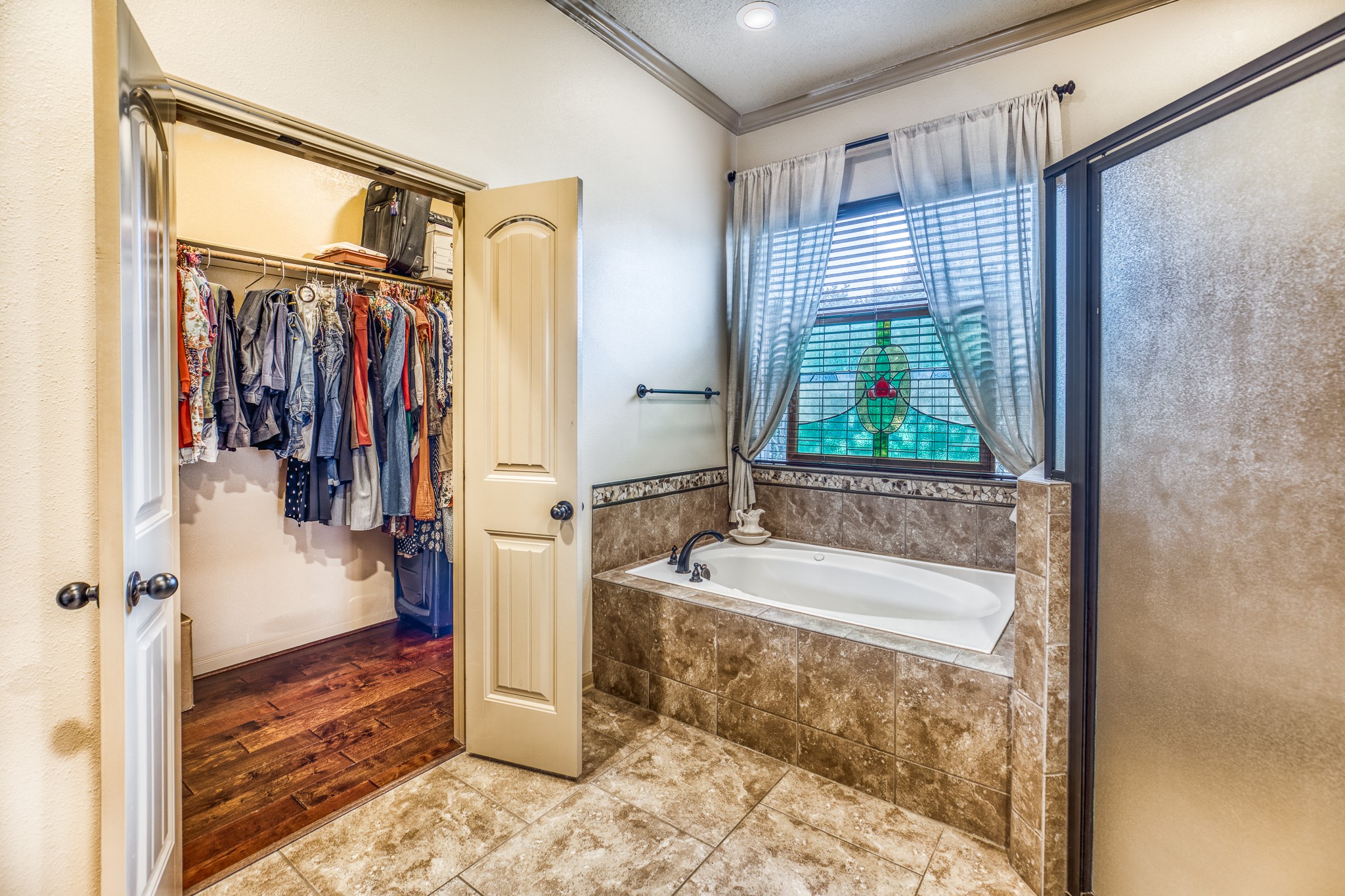 677 Grubbs Road Sealy, TX 77474 - Photo 14 of 40 a bathroom with a tub a sink and a shower