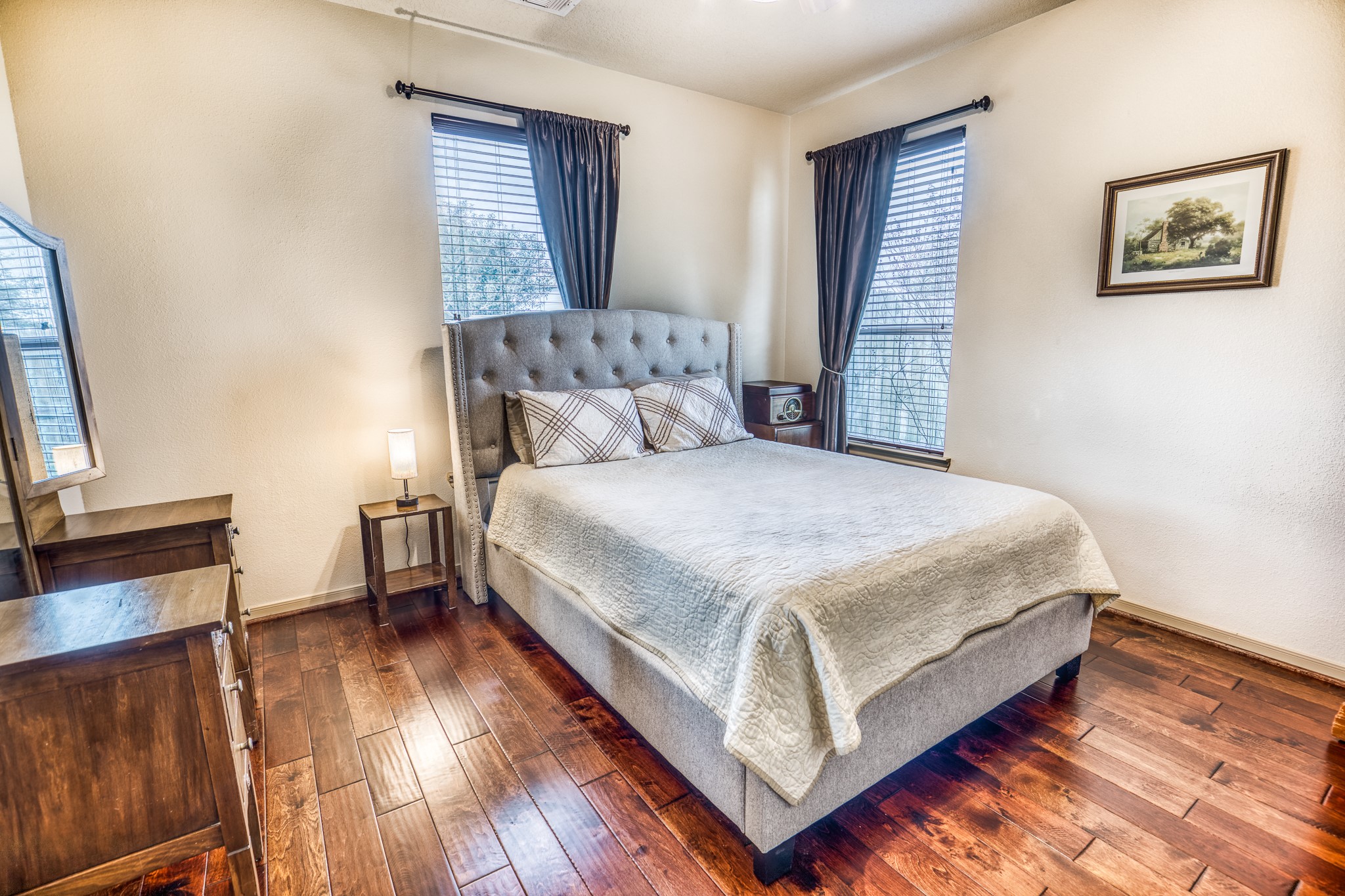 677 Grubbs Road Sealy, TX 77474 - Photo 19 of 40 a bedroom with a bed and a flat screen tv