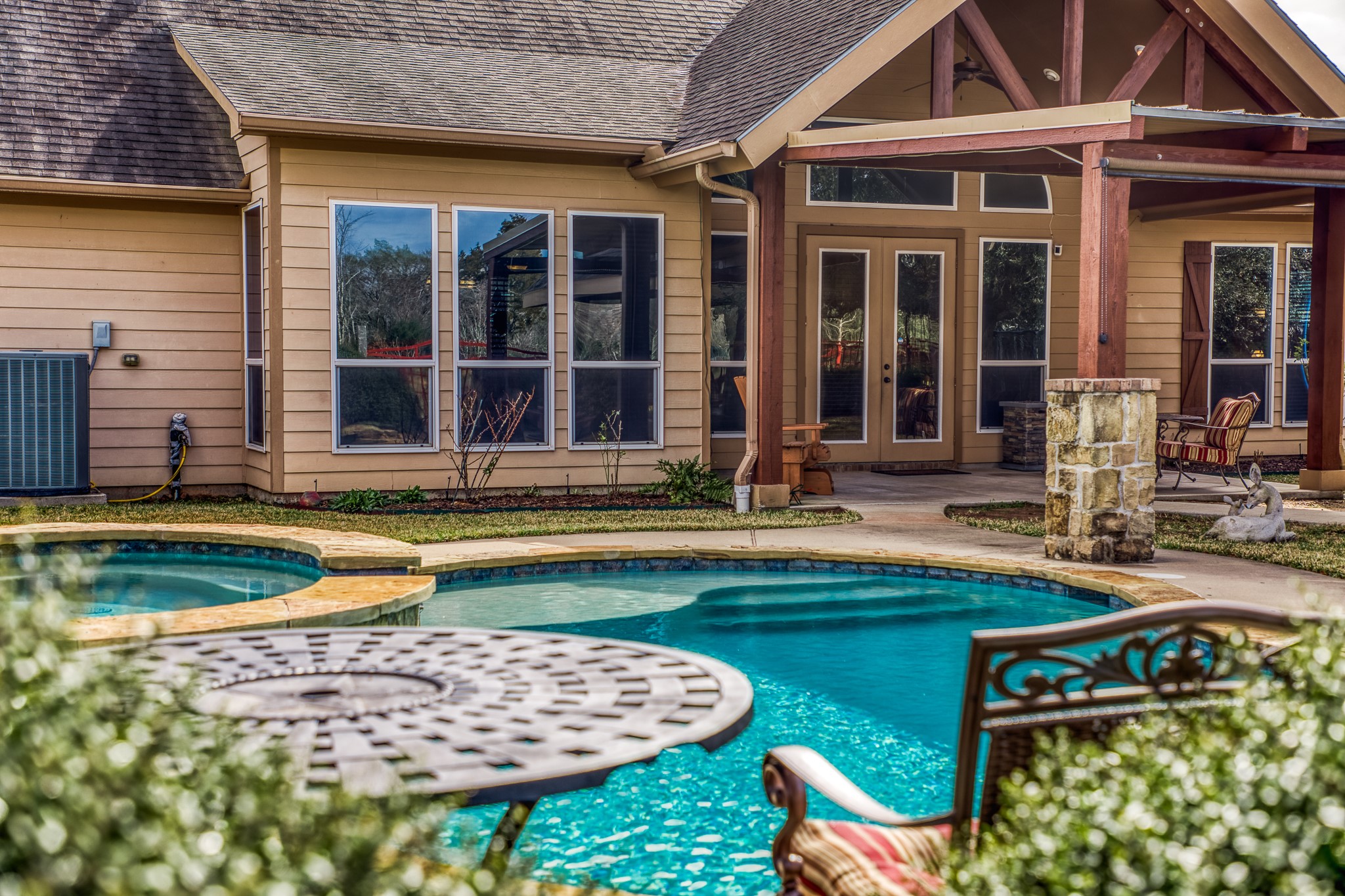 677 Grubbs Road Sealy, TX 77474 - Photo 25 of 40 a view of a house with swimming pool and sitting area