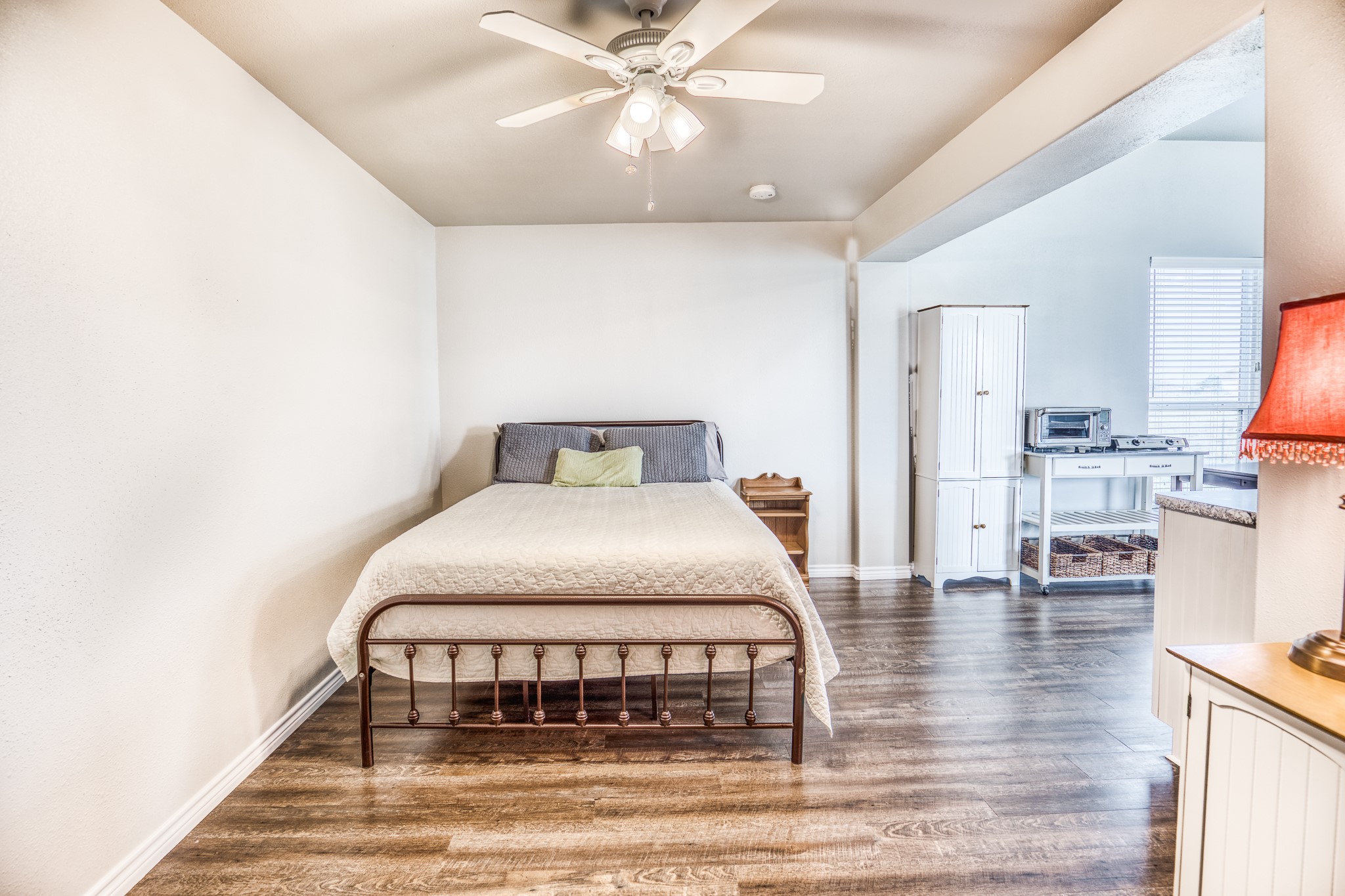 677 Grubbs Road Sealy, TX 77474 - Photo 34 of 40 a bedroom with a bed and a chandelier